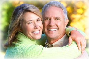 upcc elderly couple smiling embracing